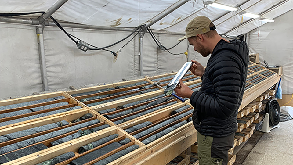 A geologist examines core samples in the core shack at the Baptiste Nickel Mine, located approximately 90 km northwest of Fort St. James, British Columbia, Canada