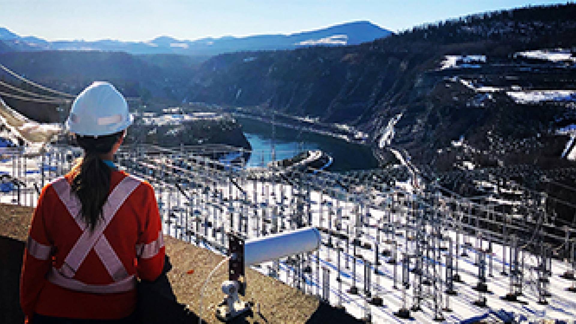 A technician looking onwards at a generating station.