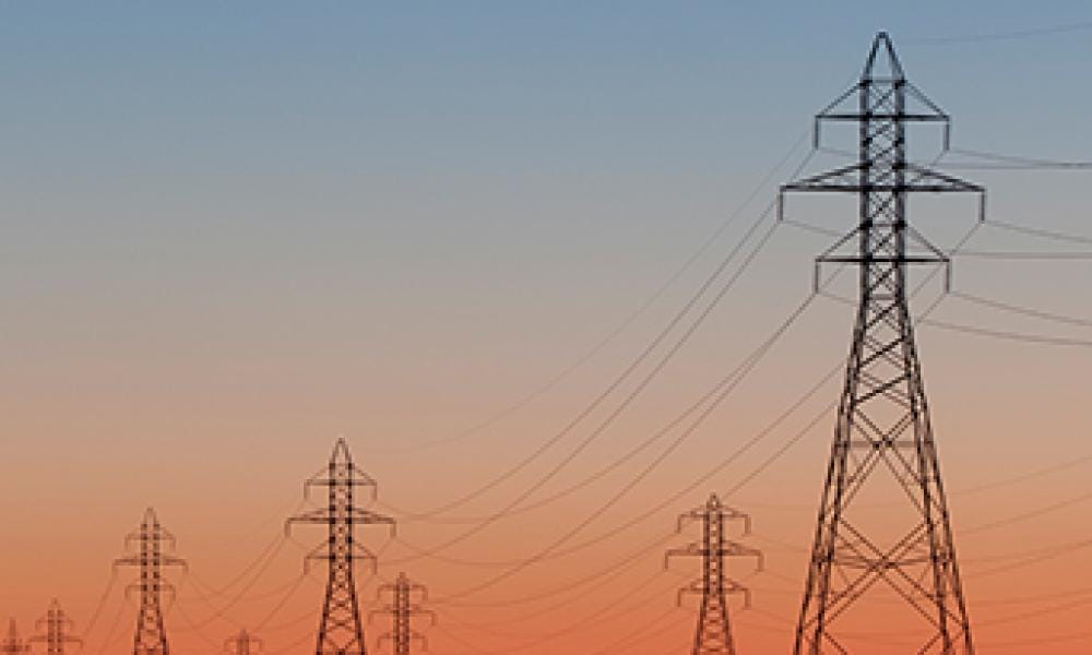 Photo of transmission lines during sunset