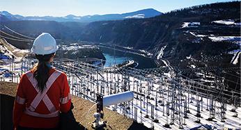 A technician looking onwards at a generating station.