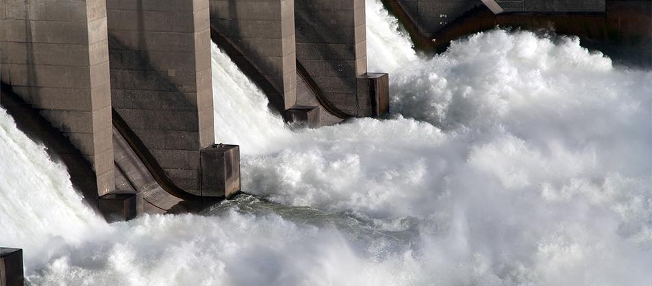 Water flowing down the Columbia River through a dam.